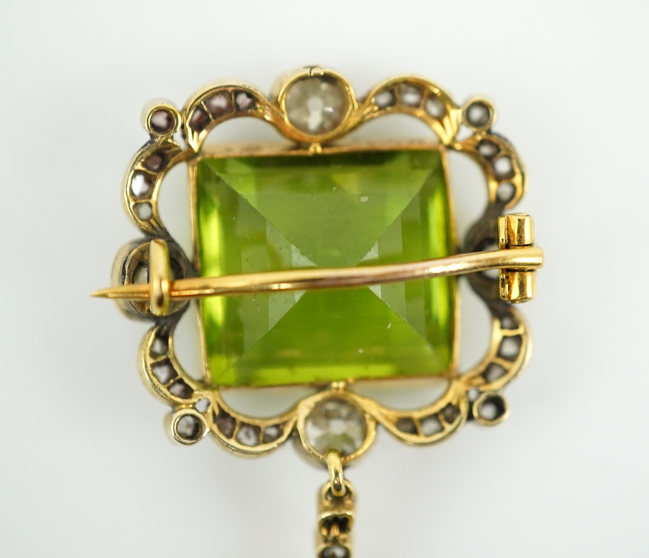 A peridot and diamond brooch, circa 1900